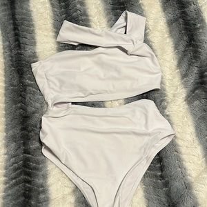 White asymmetrical suit one shoulder